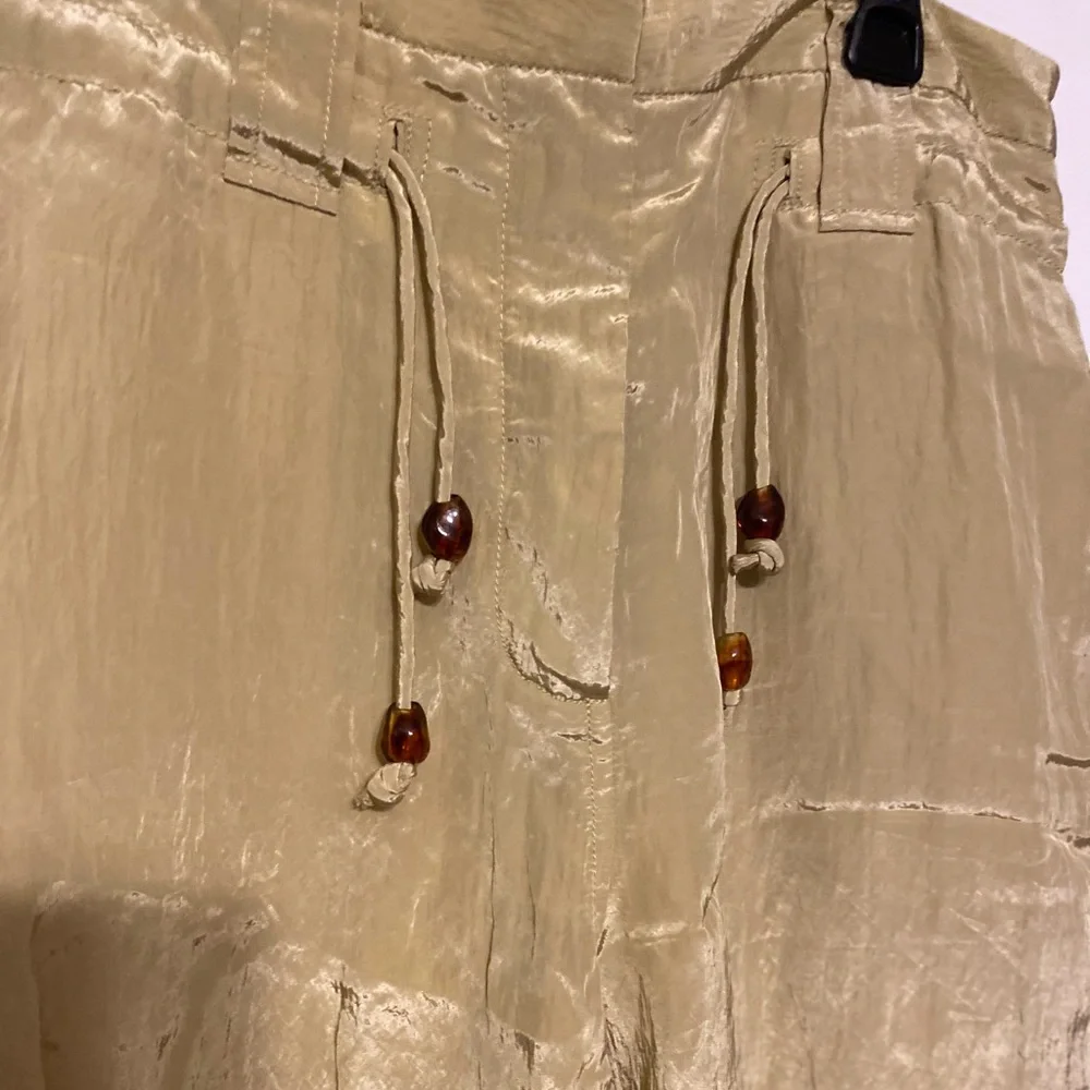GANNI $595
Crinkled satin tapered pants dusty yellow size 36 size 0 - Picture 12 of 12